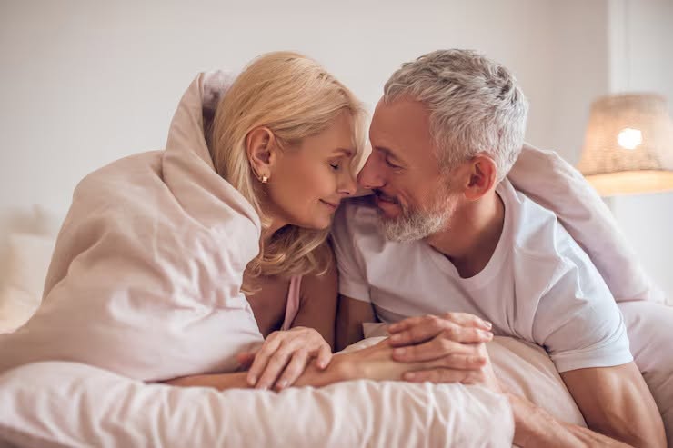 A relaxed mature couple resting together, illustrating renewed confidence in a relationship